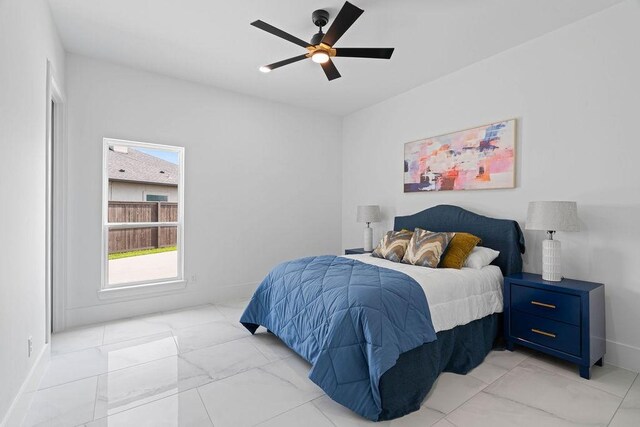 5402 Bonanza Dr, Corpus Christi, TX 78414 - bedroom with light marble finish flooring, baseboards, and a ceiling fan