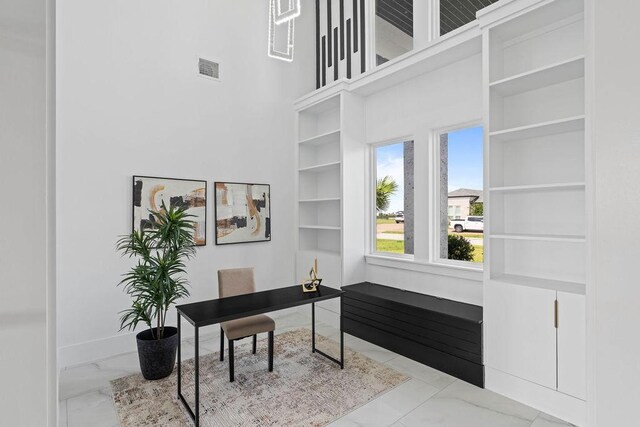 5402 Bonanza Dr, Corpus Christi, TX 78414 - office space with marble look tile flooring, a towering ceiling, and baseboards