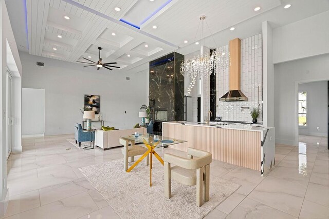 5402 Bonanza Dr, Corpus Christi, TX 78414 - kitchen featuring a high ceiling, light marble finish floors, coffered ceiling, recessed lighting, and ceiling fan