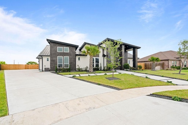 5402 Bonanza Dr, Corpus Christi, TX 78414 - contemporary house with a standing seam roof and stucco siding
