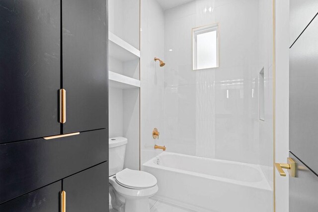 5402 Bonanza Dr, Corpus Christi, TX 78414 - bathroom with toilet, tub / shower combination, and marble look tiles