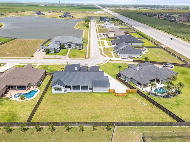 5402 Bonanza Dr, Corpus Christi, TX 78414 - aerial view of residential area with a pool area and a large body of water
