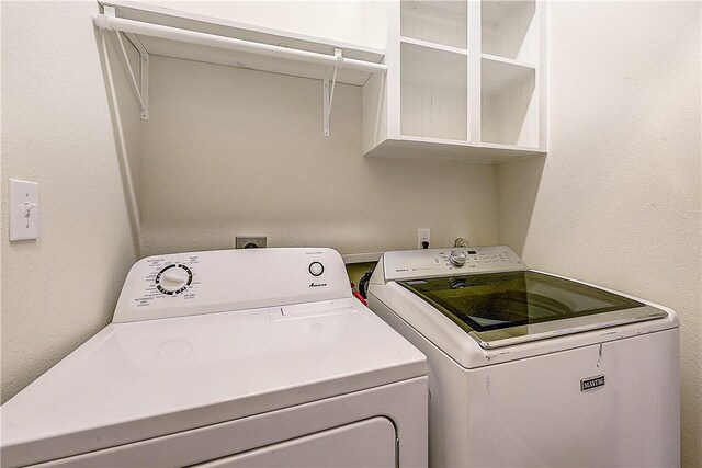 washroom with laundry area and washing machine and clothes dryer
