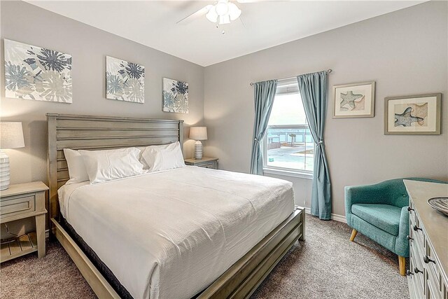 bedroom featuring carpet flooring, a ceiling fan, and baseboards
