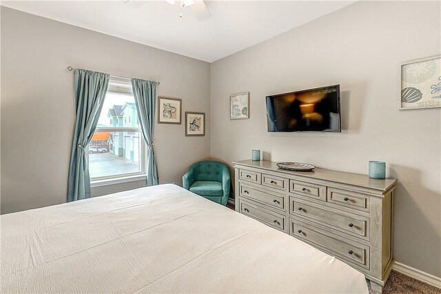 bedroom featuring a ceiling fan and baseboards