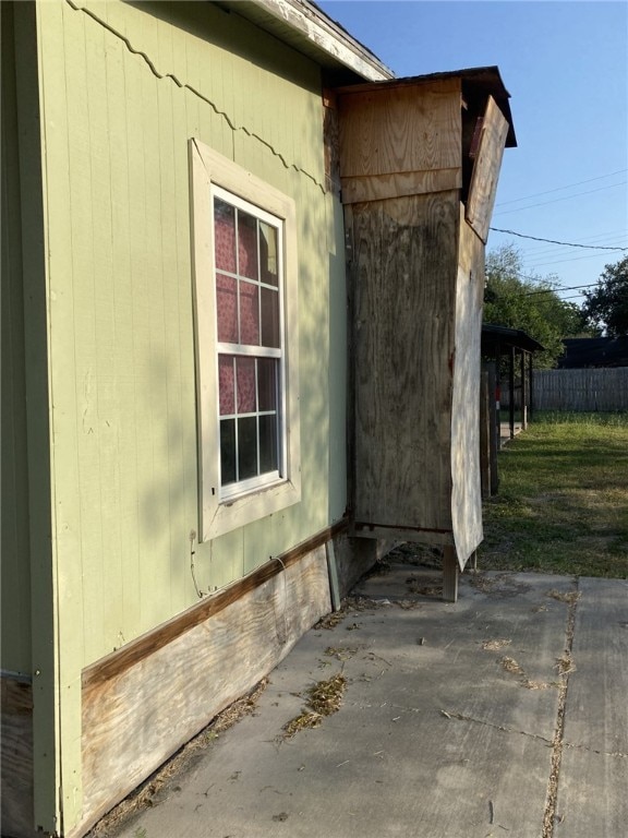 view of side of property featuring a patio