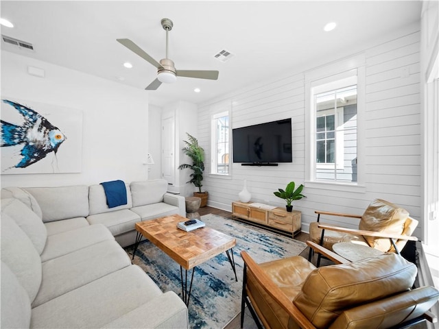 living room with recessed lighting, visible vents, and ceiling fan
