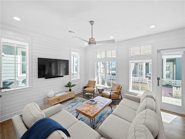 living room featuring recessed lighting, visible vents, wood finished floors, and a ceiling fan