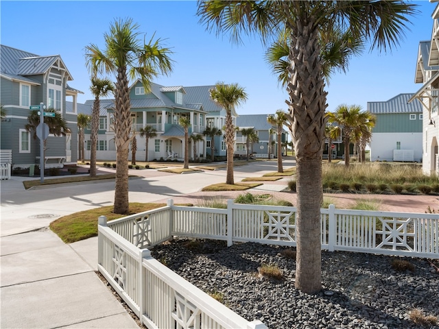 view of home's community featuring a residential view and fence