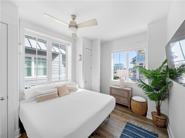 bedroom featuring wood finished floors and a ceiling fan
