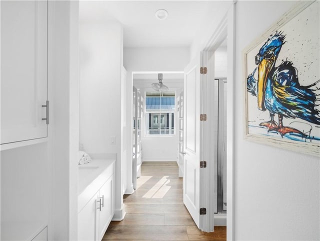 hall featuring wood finished floors