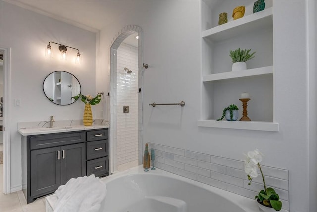 104 Emerald St, Portland, TX 78374 - full bathroom with vanity, a garden tub, built in features, and a tile shower