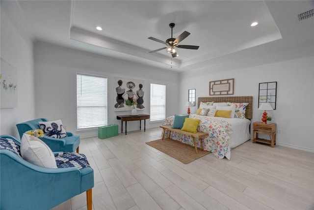104 Emerald St, Portland, TX 78374 - bedroom with a tray ceiling, light wood-style floors, recessed lighting, ceiling fan, and baseboards