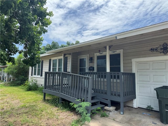 913 Clare Dr, Corpus Christi, TX 78412 - view of front of house featuring a porch, a front lawn, and a garage