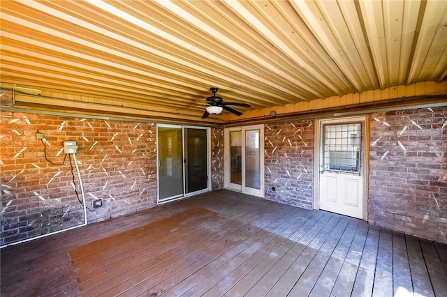 wooden deck featuring ceiling fan