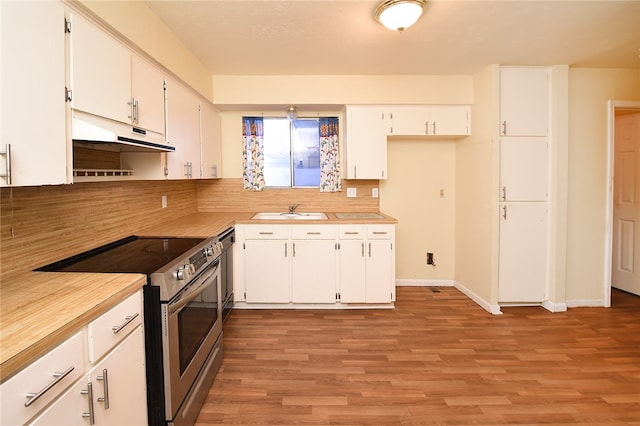 kitchen featuring light hardwood / wood-style floors, sink, backsplash, stainless steel electric stove, and white cabinetry