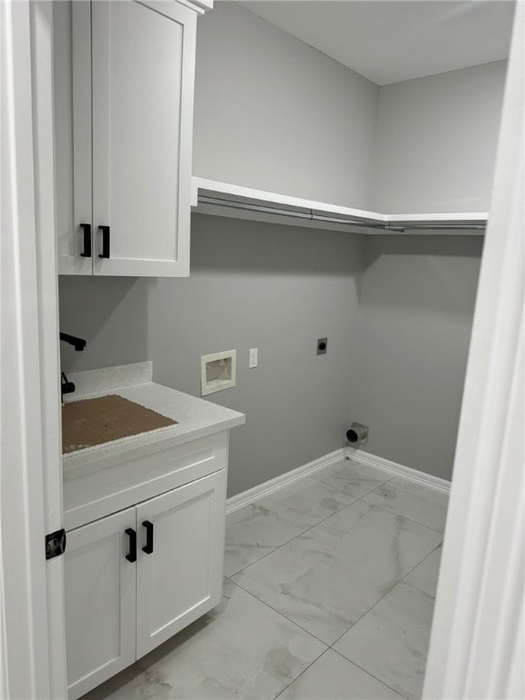 washroom featuring electric dryer hookup, cabinets, sink, and hookup for a washing machine