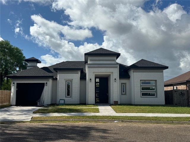 prairie-style house with a front lawn and a garage