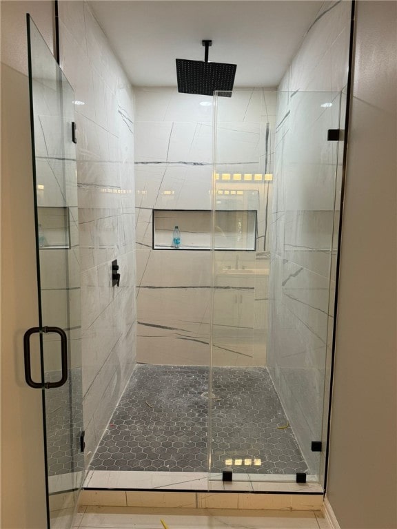 bathroom featuring an enclosed shower