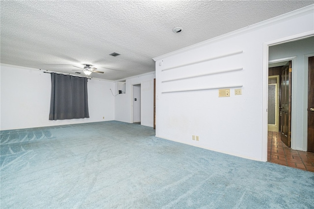 carpeted empty room with ornamental molding, a textured ceiling, and ceiling fan