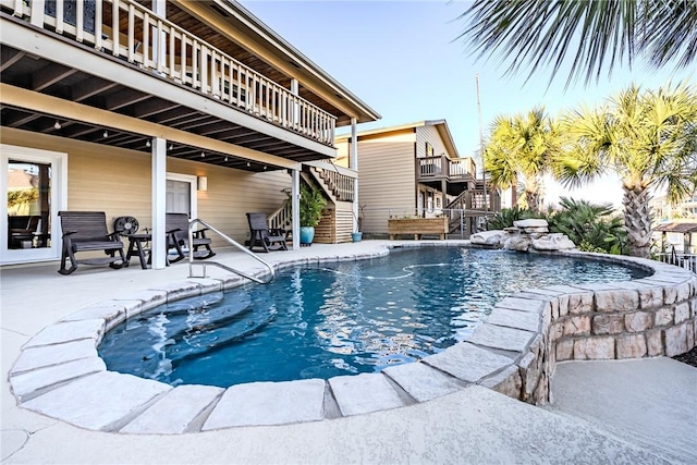 view of pool featuring a patio