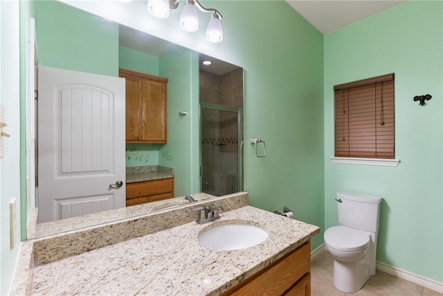 bathroom featuring walk in shower, vanity, toilet, and tile patterned floors