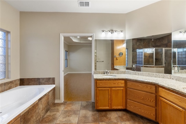 bathroom with independent shower and bath, vanity, tile patterned floors, and crown molding