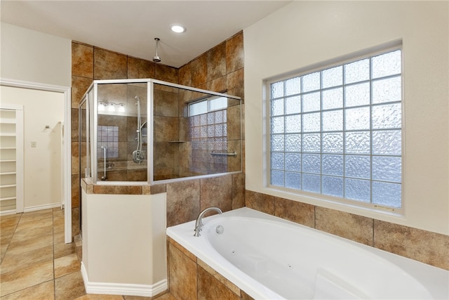 bathroom featuring tile patterned flooring and plus walk in shower