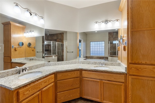 bathroom featuring shower with separate bathtub and vanity