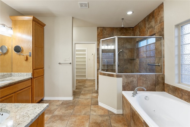 bathroom with vanity, tile patterned floors, and independent shower and bath