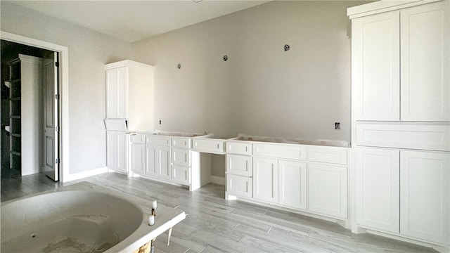 bathroom featuring a bathtub and hardwood / wood-style floors