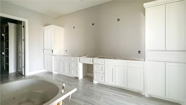 4033 Ranch Lake Dr, Corpus Christi, TX 78413 - full bathroom with a jetted tub and wood finished floors