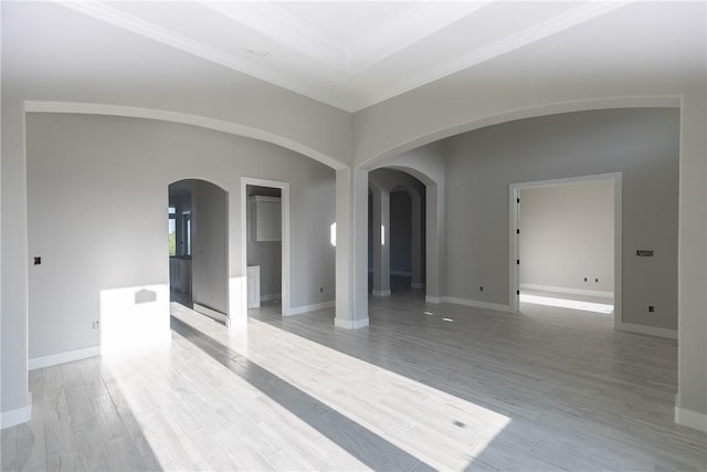 4033 Ranch Lake Dr, Corpus Christi, TX 78413 - unfurnished room featuring arched walkways, crown molding, and light wood-style floors