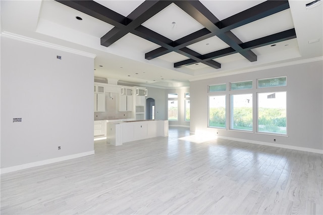 unfurnished living room featuring light hardwood / wood-style floors, beam ceiling, crown molding, and coffered ceiling