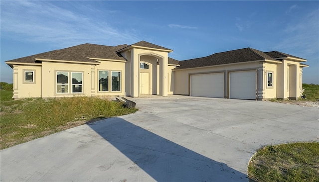 view of front of property with a garage