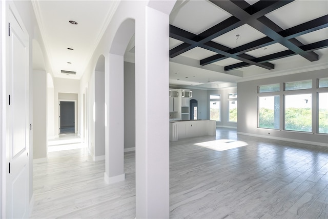 unfurnished living room featuring light hardwood / wood-style floors, beam ceiling, crown molding, and coffered ceiling