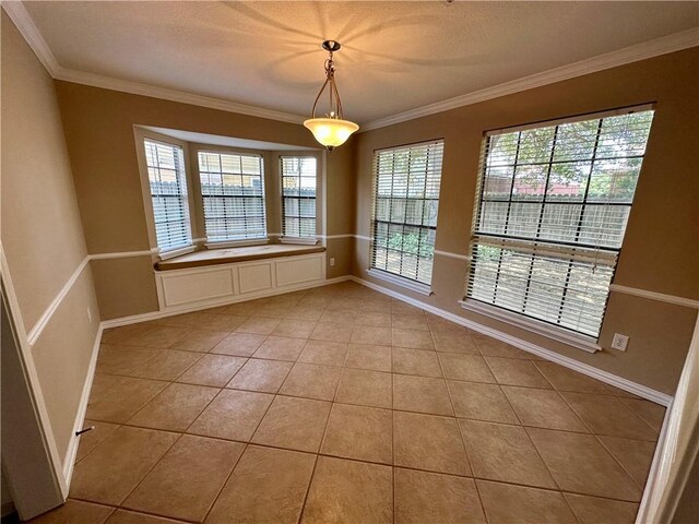6313 Ramsgate Cir, Corpus Christi, TX 78414 - unfurnished dining area featuring light tile patterned flooring, crown molding, healthy amount of natural light, and baseboards