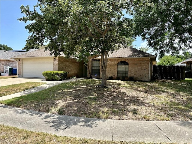 6313 Ramsgate Cir, Corpus Christi, TX 78414 - view of front of home with an attached garage, brick siding, driveway, and a shingled roof