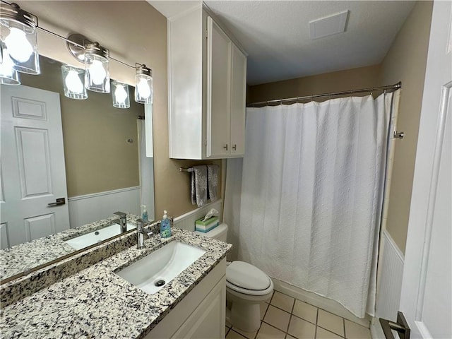 6313 Ramsgate Cir, Corpus Christi, TX 78414 - bathroom with vanity, toilet, tile patterned floors, and a shower with curtain