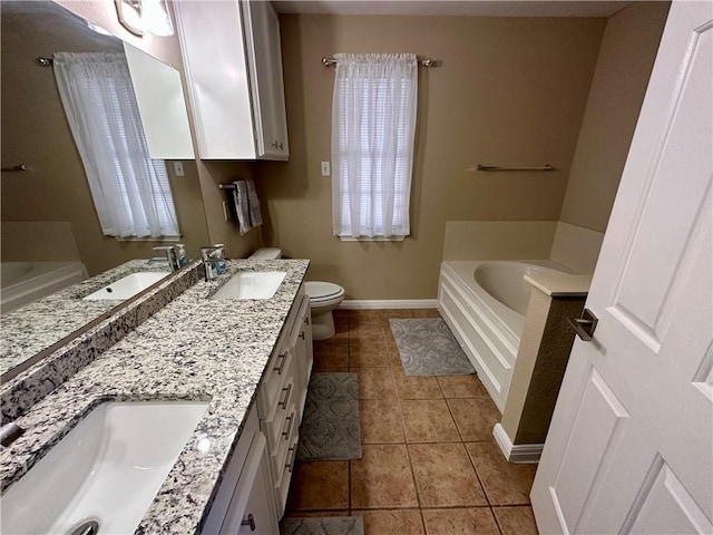 6313 Ramsgate Cir, Corpus Christi, TX 78414 - full bathroom with double vanity, a garden tub, baseboards, and tile patterned flooring