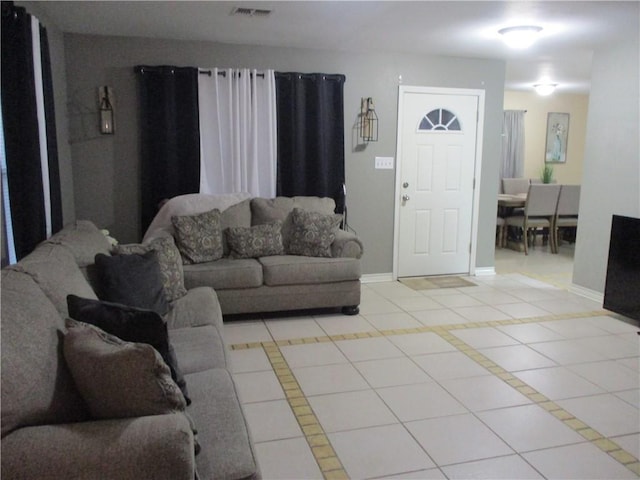 living room with light tile patterned floors