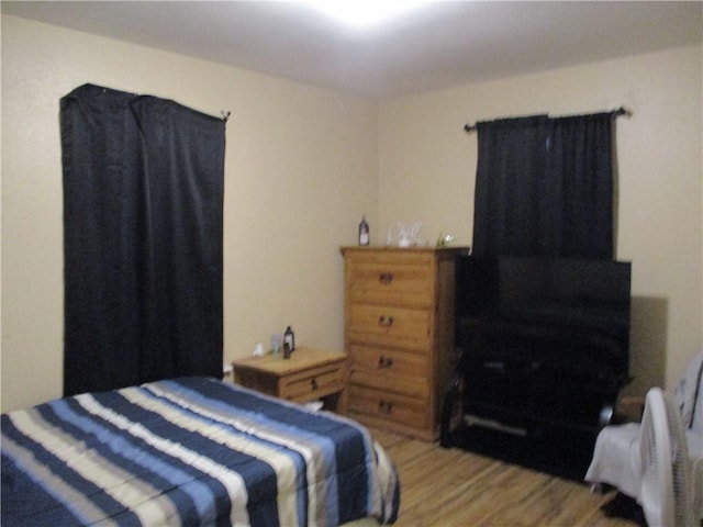 bedroom with light hardwood / wood-style floors