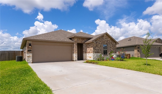1293 Carnaby St, Corpus Christi, TX 78415 - single story home with a garage, driveway, brick siding, stone siding, and roof with shingles