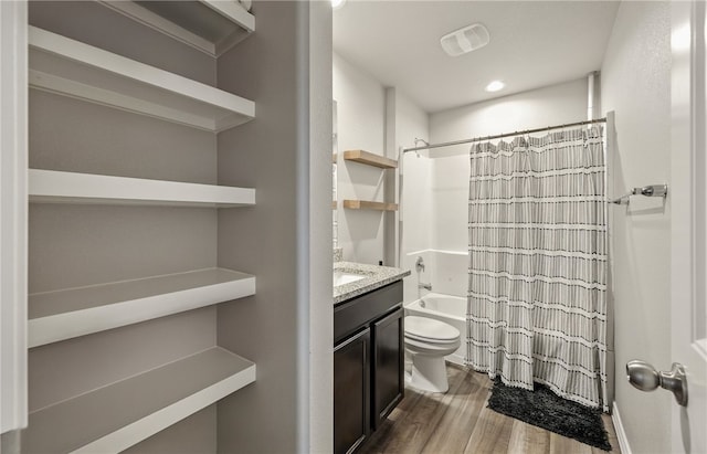 1293 Carnaby St, Corpus Christi, TX 78415 - full bathroom with wood finished floors, shower / bath combo with shower curtain, vanity, and recessed lighting