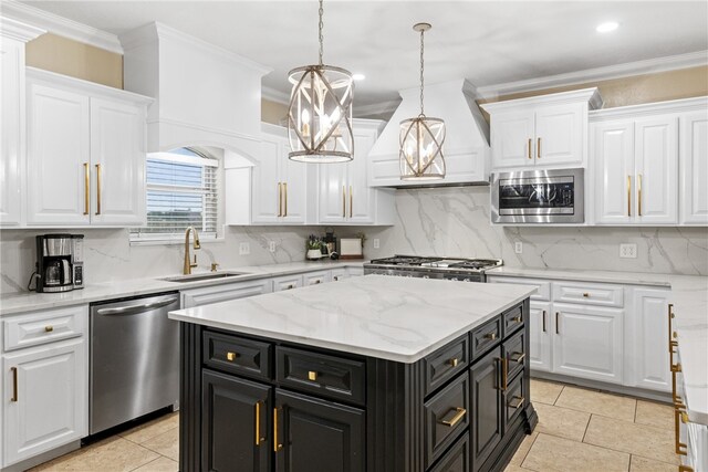 5413 King Trl, Corpus Christi, TX 78414 - kitchen with stainless steel appliances, a sink, dark cabinetry, white cabinetry, and a kitchen island