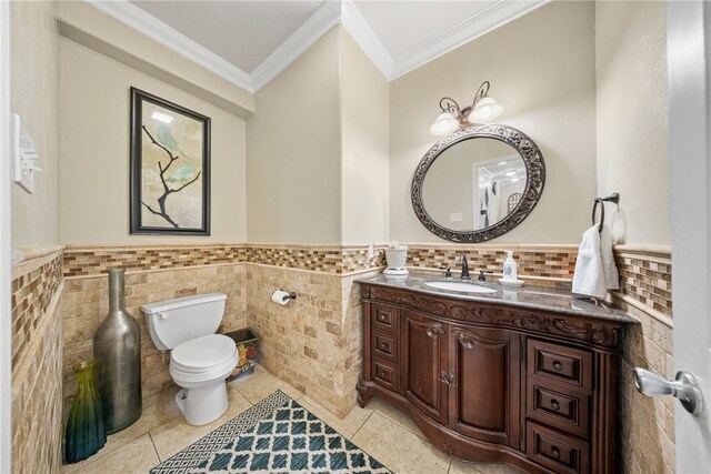 5413 King Trl, Corpus Christi, TX 78414 - half bathroom featuring ornamental molding, vanity, toilet, a wainscoted wall, and tile patterned floors
