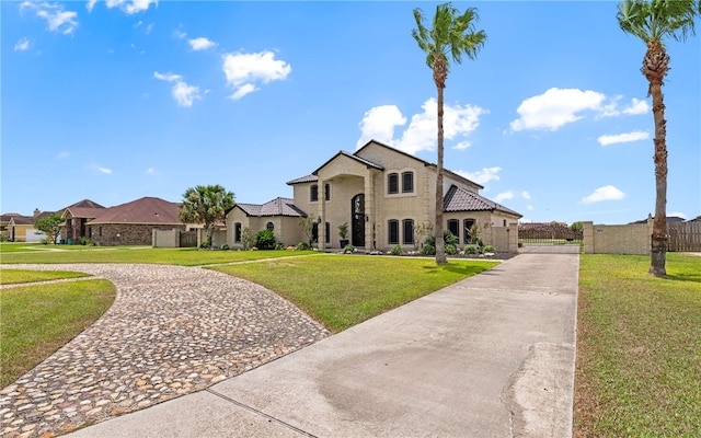 5413 King Trl, Corpus Christi, TX 78414 - french country style house featuring curved driveway, a gate, and stucco siding