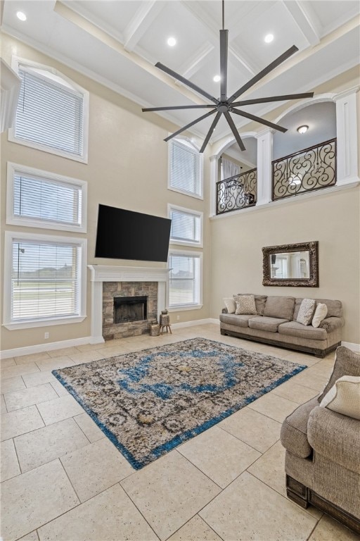 5413 King Trl, Corpus Christi, TX 78414 - living area featuring coffered ceiling, a high ceiling, baseboards, a ceiling fan, and a fireplace