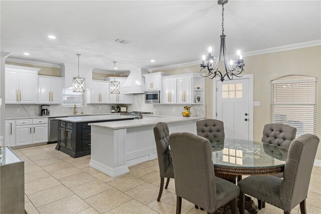 5413 King Trl, Corpus Christi, TX 78414 - dining space featuring healthy amount of natural light, crown molding, a chandelier, light tile patterned floors, and recessed lighting