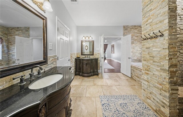 5413 King Trl, Corpus Christi, TX 78414 - full bath featuring two vanities, tiled bath, and tile patterned flooring